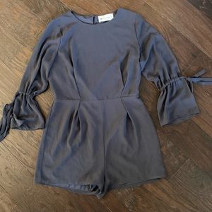 Never worn!!! The Impeccable Pig boutique. Grey romper.  Long sleeve